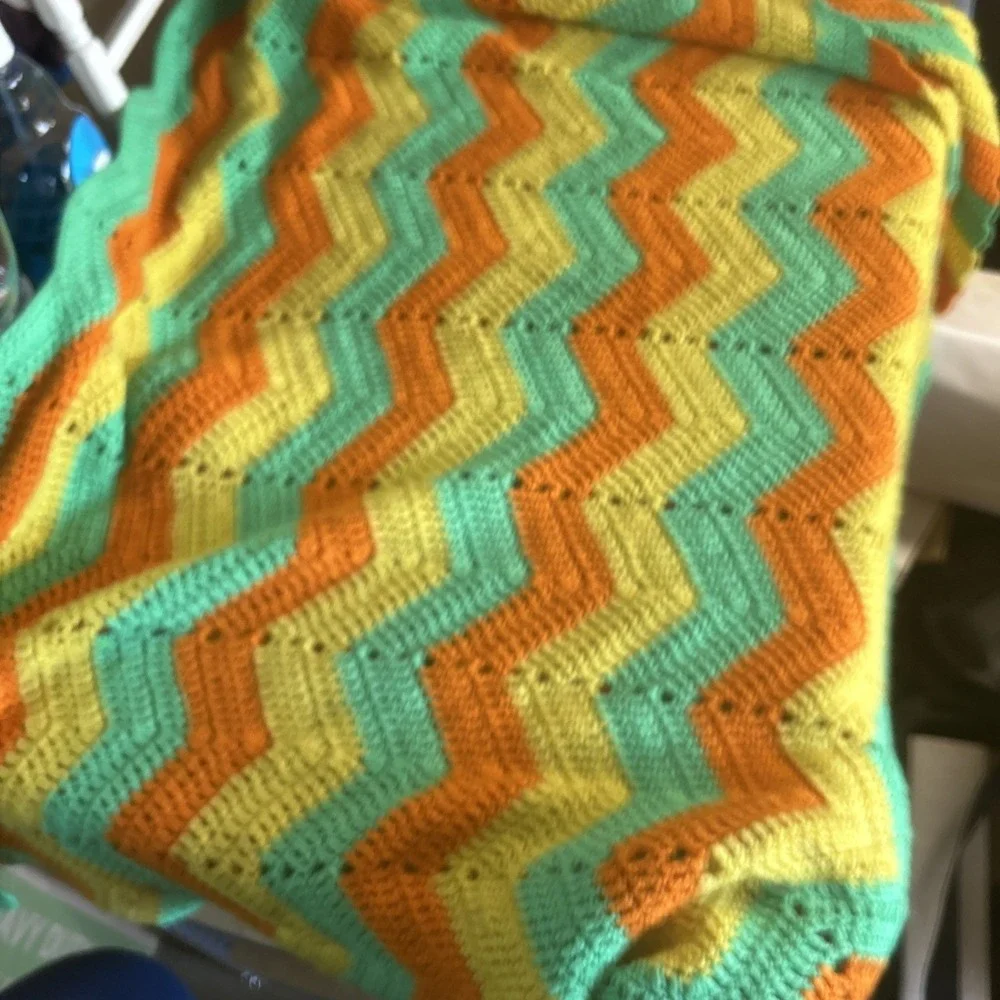 a vintage handmade crochet ripple or chevron pattern blanket 50